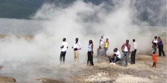 Local tourists enjoy the spray from geysers at Lake Bogoria. The lake has over 200 geysers around it, and is a habitat for flamingoes and other wildlife. PHOTO | JARED NYATAYA | NMG